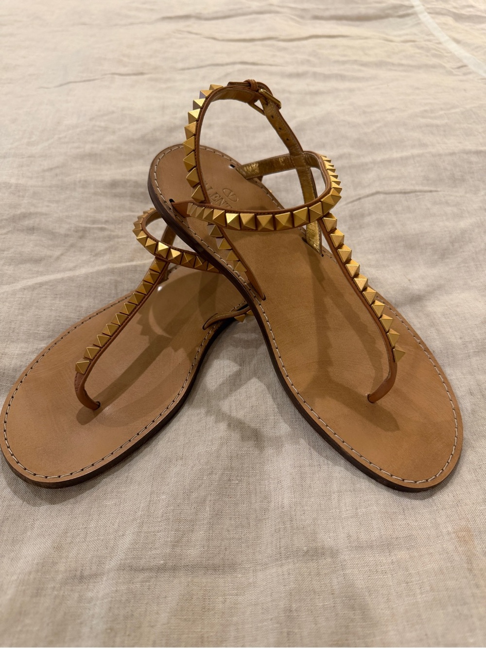 Valentino Garavani Tan Leather T-Strap Sandals with Gold Pyramid Studs
